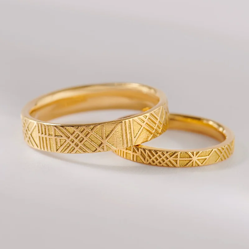 Shop Dazzling Jewelry With Special Promotional Discounts The Unique and Geometric - A Set of Golden Wedding Bands Shop Dazzling Jewelry With Special Promotional Discounts The Unique and Geometric - A Set of Golden Wedding Bands