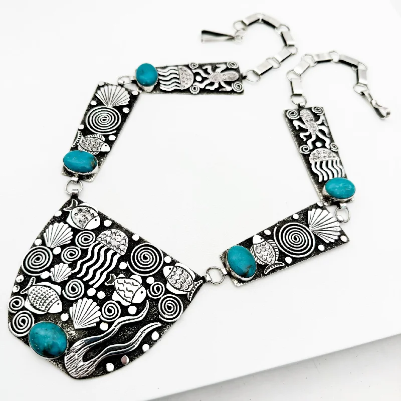 Elevate Your Outfit With Discounted Statement Jewelry Alex Sanchez "Under the Sea" Petroglyph Necklace Elevate Your Outfit With Discounted Statement Jewelry Alex Sanchez "Under the Sea" Petroglyph Necklace