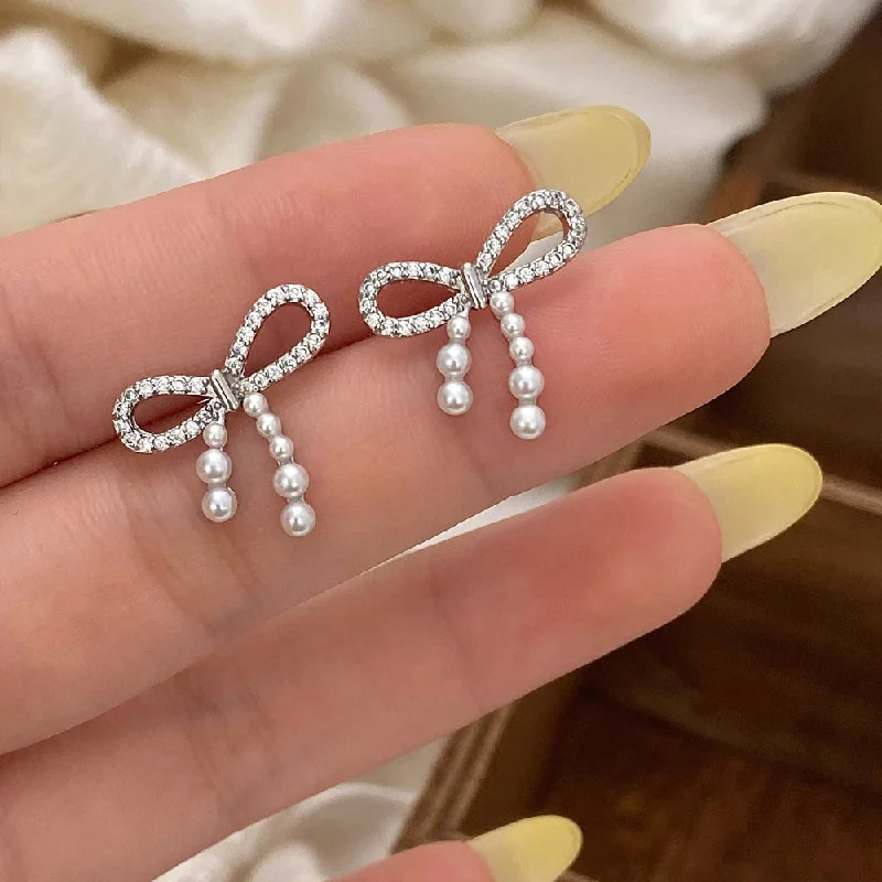 Trending Jewelry Now At Unbeatable Prices Pearl Drop Bow Styled Silver Pin Earrings JLT12911 Trending Jewelry Now At Unbeatable Prices Pearl Drop Bow Styled Silver Pin Earrings JLT12911